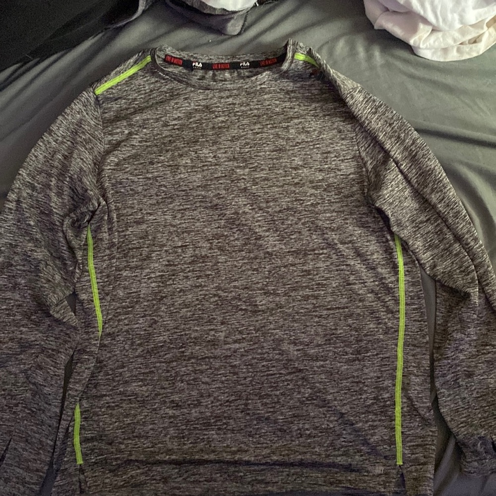 I’m selling a fila sport long sleeve silk shirt with spots for your thumbs